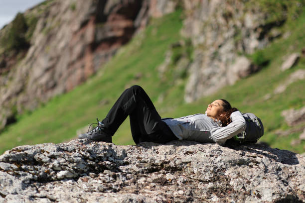 Free Stock Photo of Woman lying down on a rock surface | Download Free ...