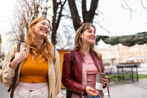 istock Smiling female students hanging out after classes 2057610499