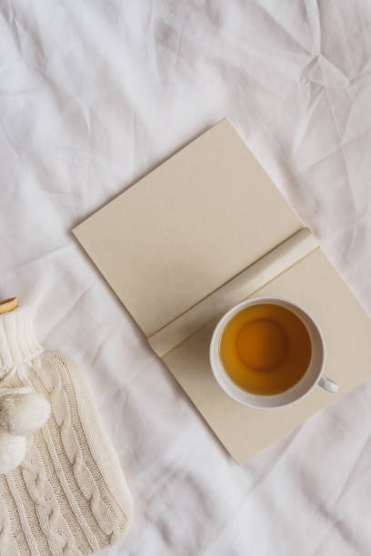 istock A teacup and a book on a bed 2057622270