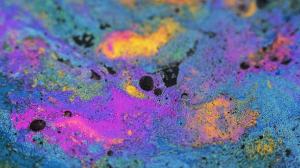 istock Wet dye background blue purple yellow black waves 2057627540