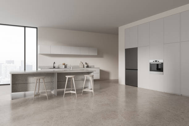 istock Corner view of home kitchen interior with bar island and cooking cabinet, window 2057654621