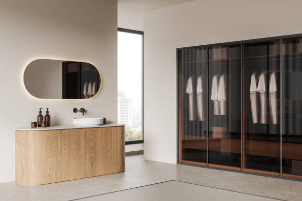 istock Modern home bathroom interior with sink and wardrobe, panoramic window 2057663251