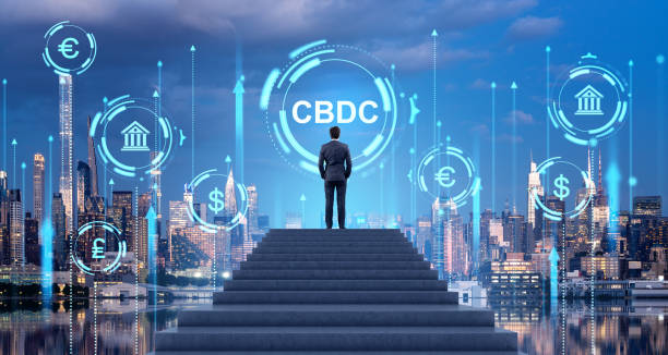 istock Man on stairs in night city and CBDC interface 2057663758