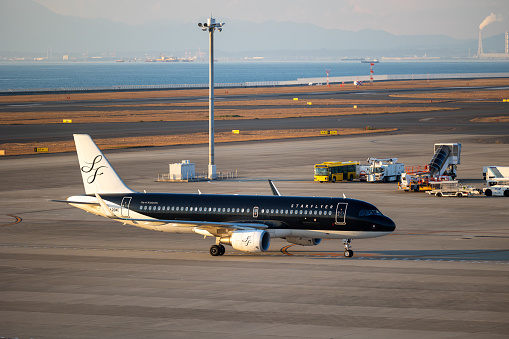 Tokoname, Japan - December 25, 2023 : Starflyer Airbus A320 at the Chubu Centrair International Airport in Tokoname City, Aichi Prefecture, Japan.