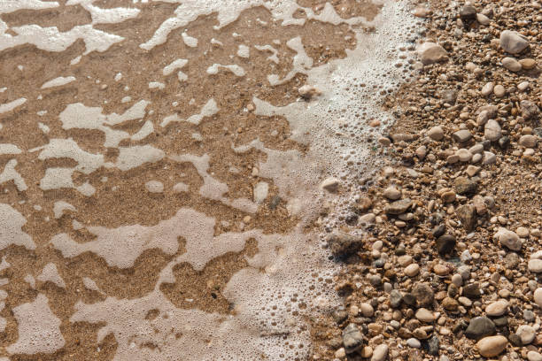 Pebbles on the seashore, close-up. Natural background