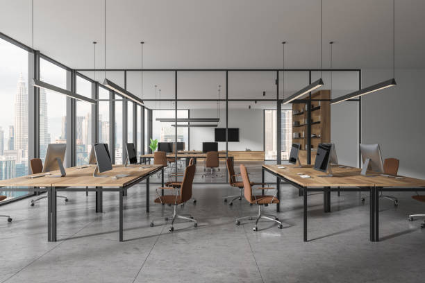 istock Business coworking interior with desk and pc desktop in row, panoramic window 2057678971