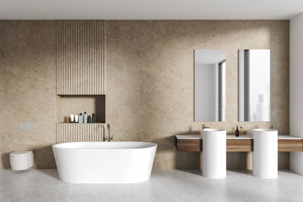 istock Light stone bathroom interior with double sink and tub 2057683284