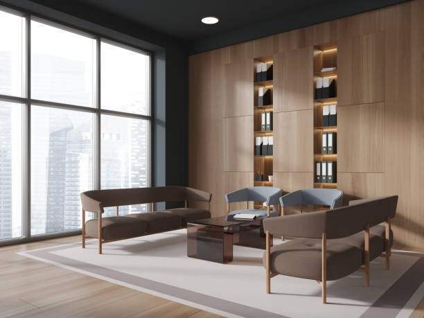 istock Wooden office chill space interior with couch and armchairs, window 2057686977