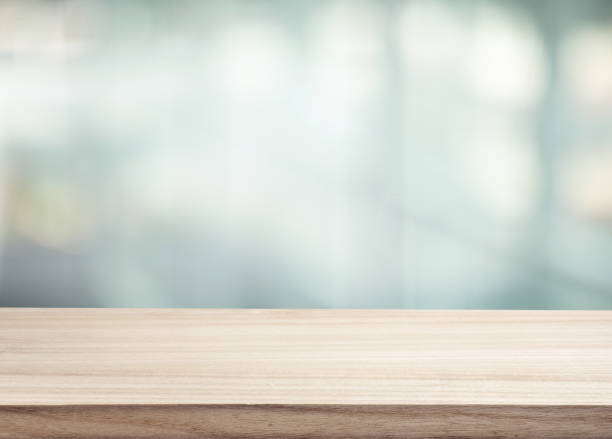 istock Selective focus.Top of wood  table with window glass background 2057694897