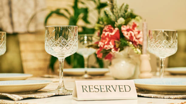 istock Reserved table in a restaurant with glasses and a red flower 2057706004