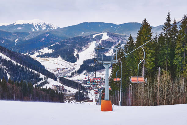 istock Cable car. Passenger ski lift on a snowy mountain slope 2057707567