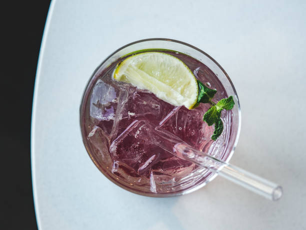 istock Beautiful glass with a refresh cocktail, standing on a table 2057711240