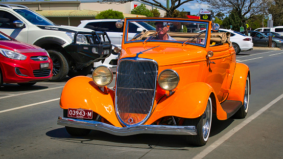 Yarrawonga, Victoria, Australia - 5 November 2022: Orange vintage classic stealing the show in the main street of Yarrawonga