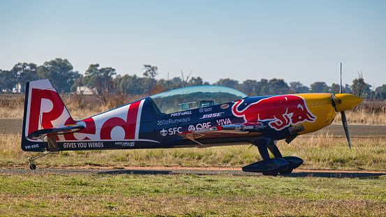 Yarrawonga, Victoria, Australia - 22 April 2023: Ready for an airshow at Yarrawonga a Red Bull racing and aerobatic plane on the tarmac