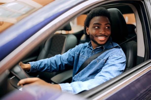 istock Cheerful man driving car 2057733119