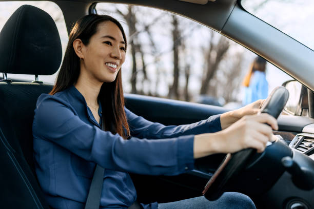 istock Well dressed beautiful woman driving car 2057734238