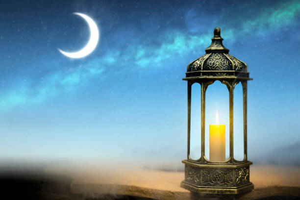 istock Ornamental Arabic lantern with burning candle glowing 2057774738
