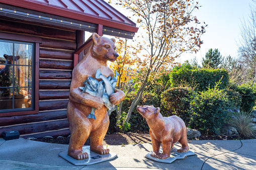 Grants Pass, Oregon, USA - November 23rd, 2023: Bear sculptures at TapRock restaurant building