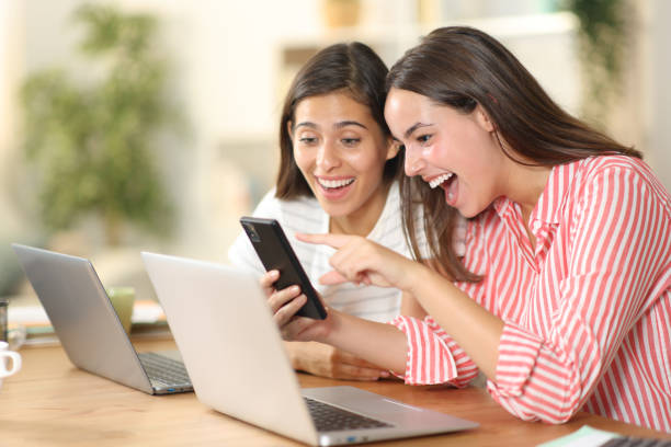 istock Happy tele workers watching amazing phone content 2057779970