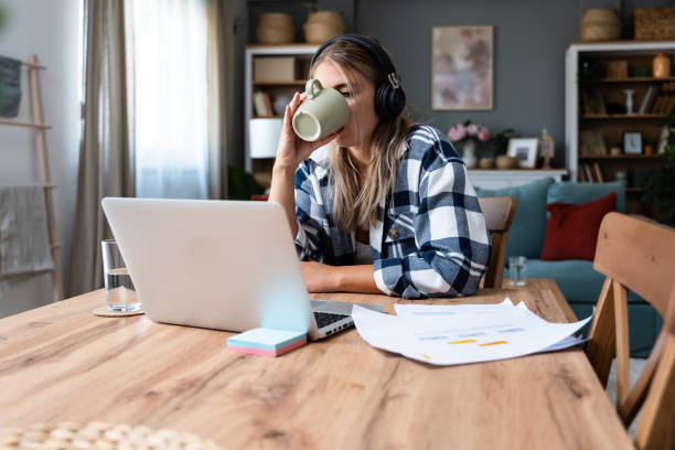 istock Side hustle money, second job concept. Young university student woman working freelance internet online job to pay student loan, saving money for rent, travel vacation Finance and economy video call 2057804076