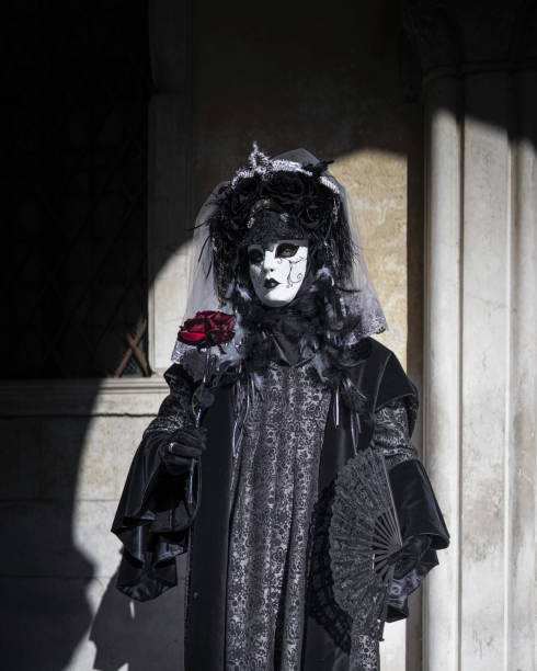 Venice, Italy - February 11, 2024: The Carnival of Venice (Italian: Carnevale di Venezia) is an annual festival held in Venice, Italy, famous throughout the world for its elaborate costumes and masks. \nThe Carnival ends on Shrove Tuesday (Martedì Grasso or Mardi Gras), which is the day before the start of Lent on Ash Wednesday (February-March).\nThe Carnival traces its origins to the Middle Ages, existing for several centuries until it was abolished in 1797. The tradition was revived in 1979, and the modern event now attracts approximately 3 million visitors annually.