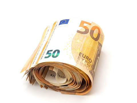 A close-up view of a roll of 50 Euro banknotes on a white background.
