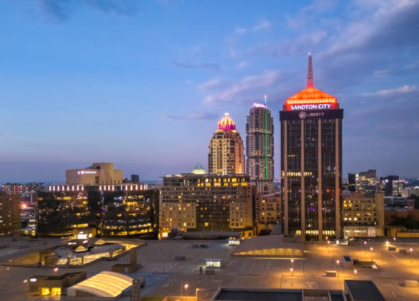 Johannesburg,  Sandton City, Gauteng, South Africa - March 3, 2024: Cityscape in Johannesburg with the three towers at sunset with the rooftop car park. Sandton has become home to most of the major financial, consulting and banking firms in South Africa.