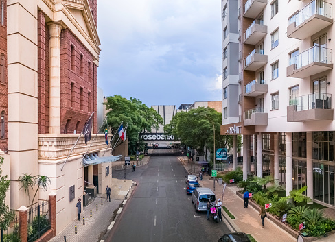 Johannesburg, Rosebank, Gauteng, South Africa - March 3, 2024: Rosebank Shopping Mall with 54 Bath Avenue Hotel on the left facing The Tyrwhitt apartment block. Rosebank has a metro station and has become a business and residential suburb.