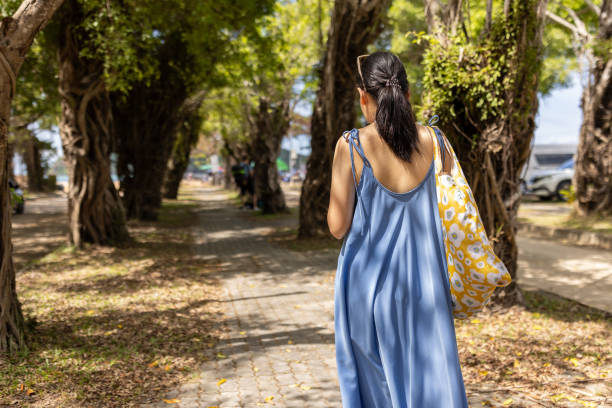 istock Woman walking on sidewalk 2057848817