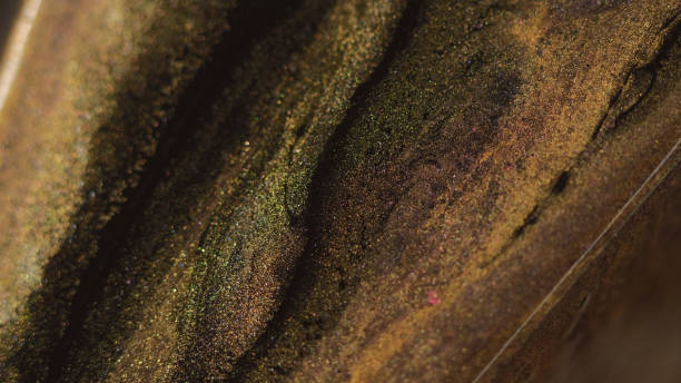 Glitter paint spill marble texture golden black