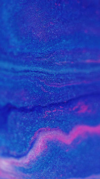 istock Blur glitter wave ink spill blue pink particles 2057853138