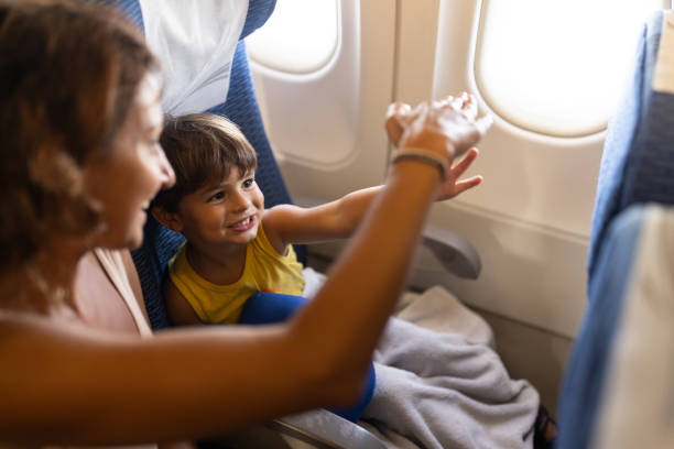 istock Woman and son traveling by plane 2057853147