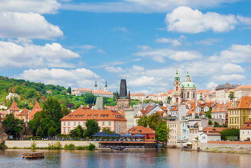 Prague, Czech Republic - July 16, 2022:  Mala Strana old district with St Nicholas Church, Strahov Monastery, Bridge Tower and Vltava River in Prague