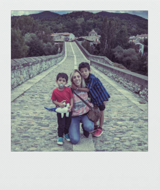 istock Mother and children on medieval bridge 2057865050