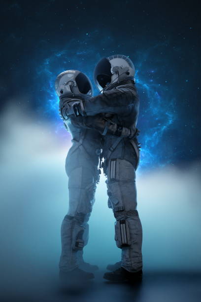 istock Two astronauts couple in a tender embrace, silhouetted against a nebula-like celestial backdrop, capturing a moment of connection in the vastness of space, love hug, man and woman. 3d render 2057883033