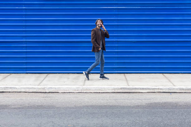 istock View of a young man with  smartphone walking 2057885767
