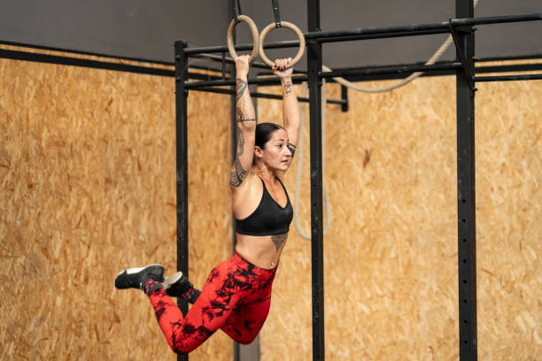 istock Fit woman working out with olympic rings 2057889474