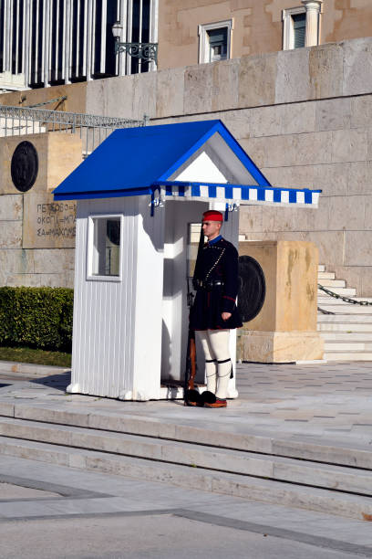 Athens, Greece - May 10, 2025: Evzones, members of the Presidential Guard, changing guard in front of the Tomb of the Unknown Soldier which is located in front of the Greek Parliament Building on Syntagma Square, Athens, Greece.