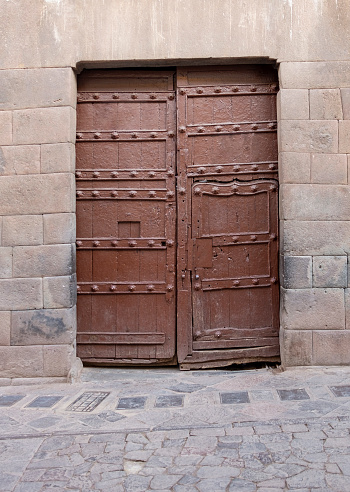 An Old Studded Wooden Door Painted Brown