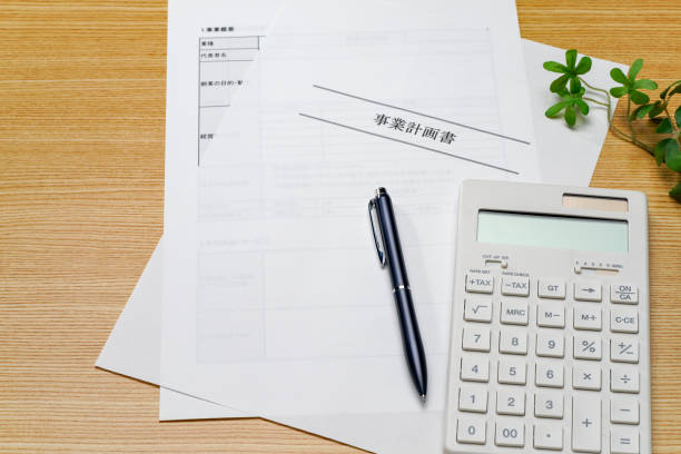 istock Business plan, pen and calculator on wooden table 2057901816