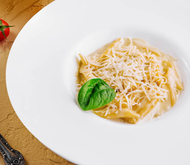 istock penne pasta with parmesan 2057953070