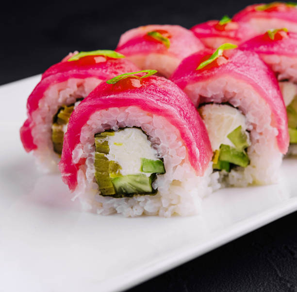 istock Tuna Maki Sushi on white plate 2057963704