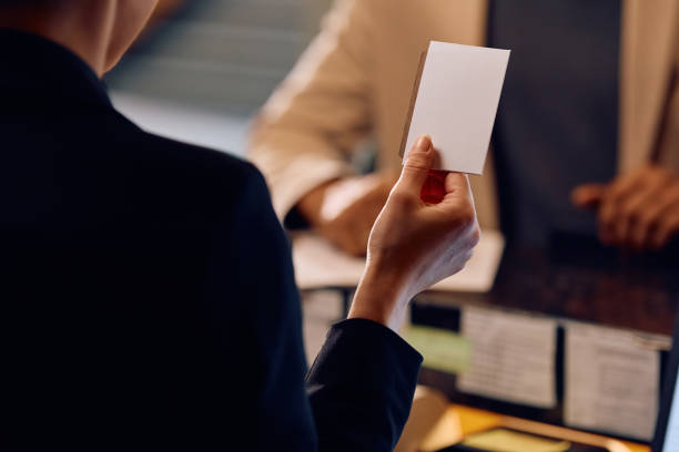 istock Close up of hotel receptions giving room cardkey to a guest. 2057972739