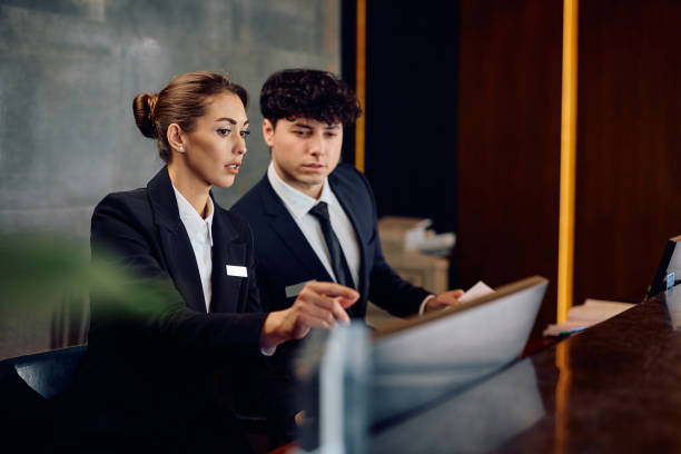Hotel Receptionist Job Using Computer 3,100+ Hotel Front Desk On Computer Stock Photos, Pictures & Royalty ...