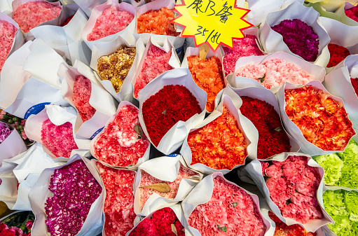 The dried roses are in the basket, in a rose processing factory, Sanya, South China