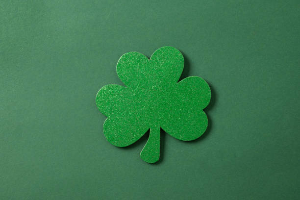 istock St. Patrick's day clover isolated on green. 2058012318