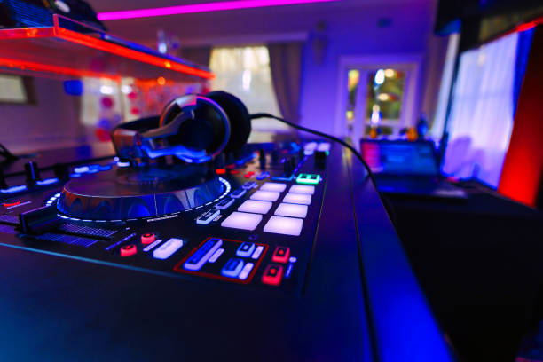 istock DJ table mixer closeup in the empty nightclub before the party 2058025209