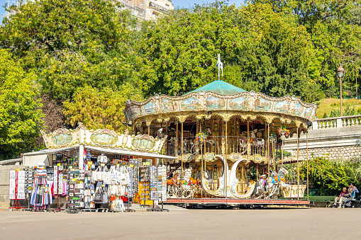 Paris, France - September 10, 2023 : Old carousel and souvenir shop in Montmartre hill in Paris, France