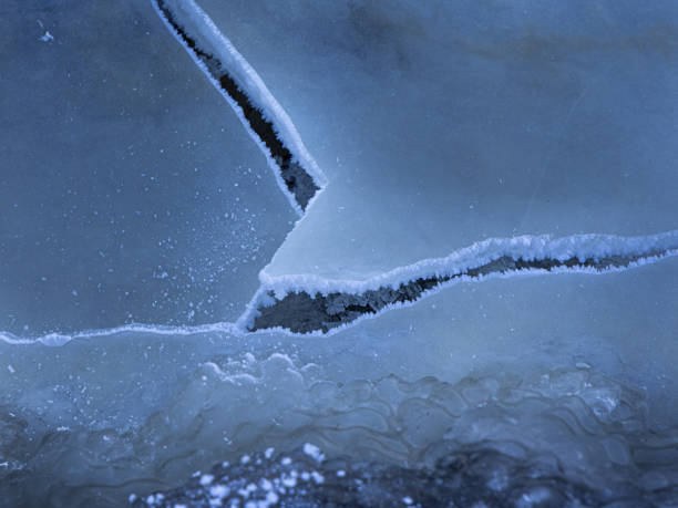 istock A beautiful cracked ice patterns on the frozen lake surface during winter in Latva. 2058063907