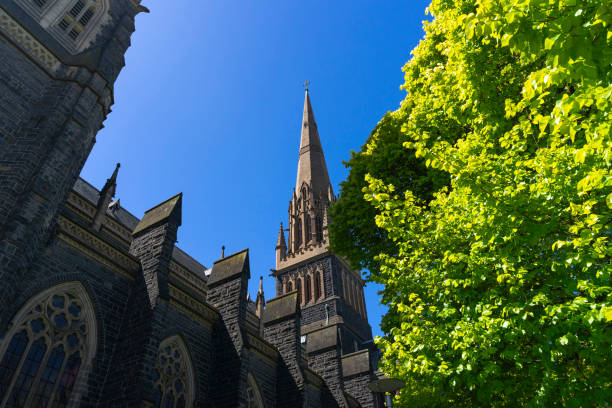 St Patrick's Cathedral and spire with blue sky in Melbourne, Australia.